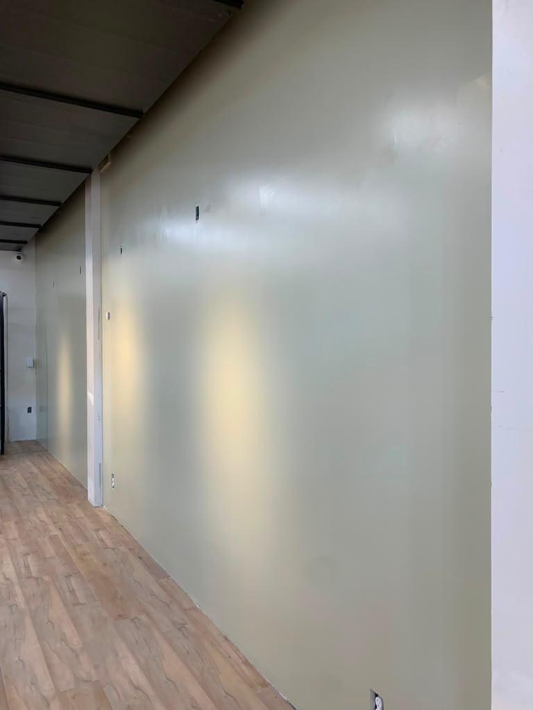 Wall surface before premium preparation and Level 5 finishing